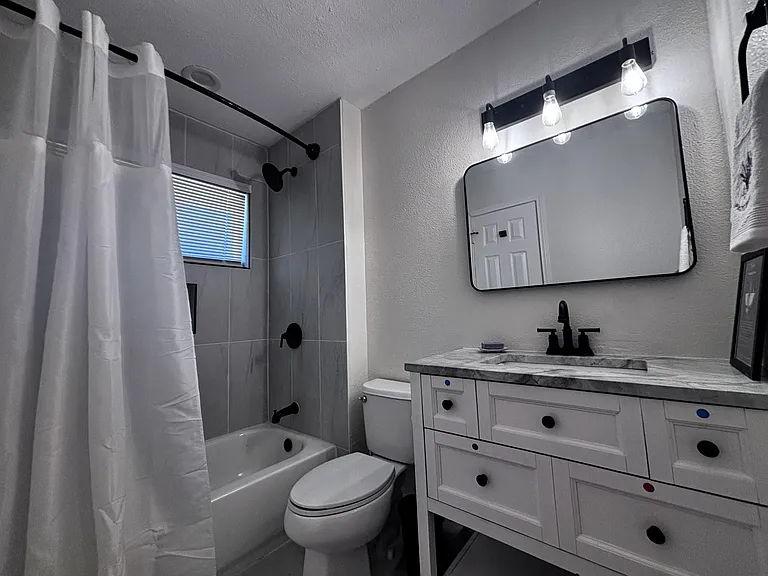 Shared bathroom with shower tub, vanity has 1 drawer per roommate (3). Professionally cleaned monthly, & roommate-friendly