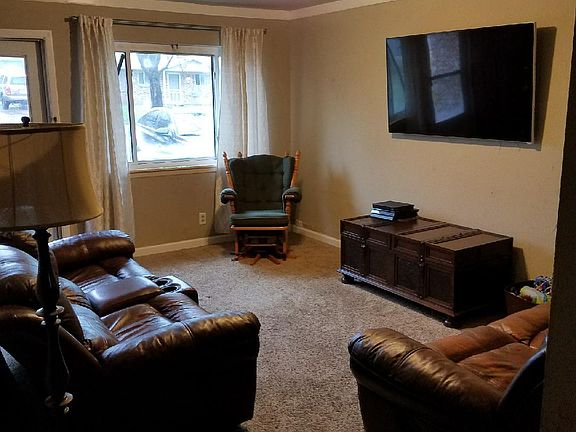 Living area view from dining area with molding