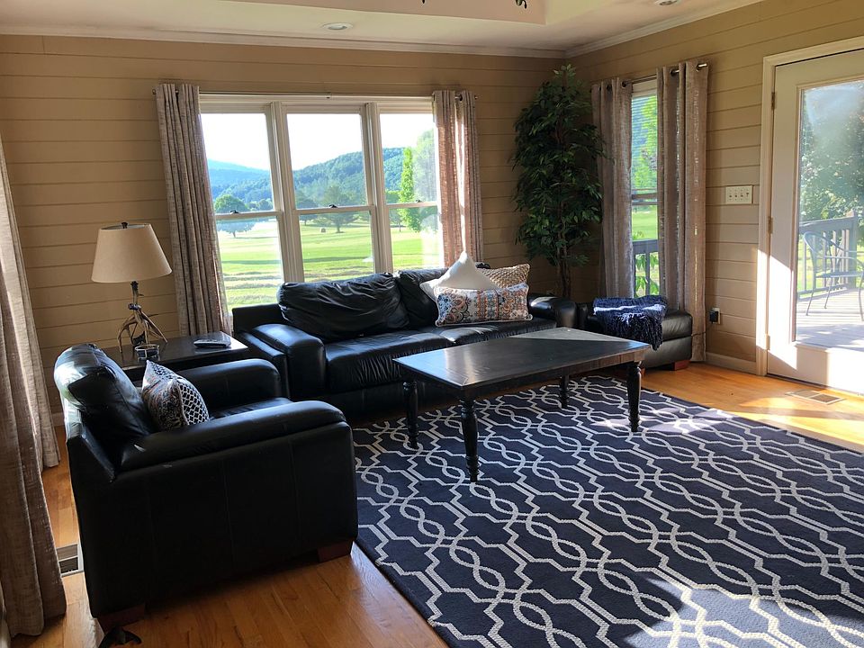 Living room w/ natural light and doors to back porch