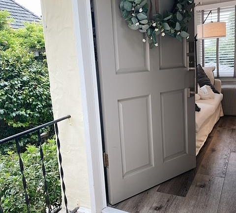 Private front door that is tucked away from street view