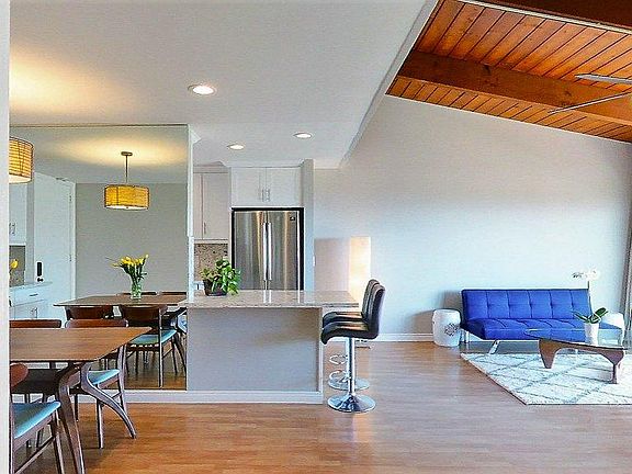 Raised ceilings and lofted living area with remodeled kitchen and baths.