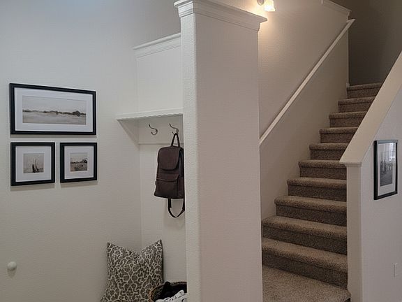 Upon entering through the front door, you are welcomed with open spaces. During snowy weather, you've got a place to put your hat, coat and shoes.