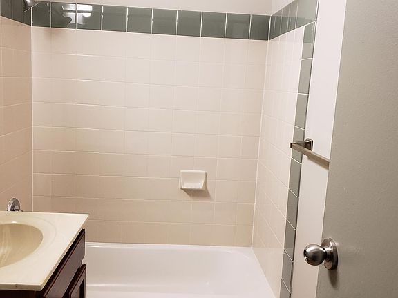 Bathroom with ceramic tile surround