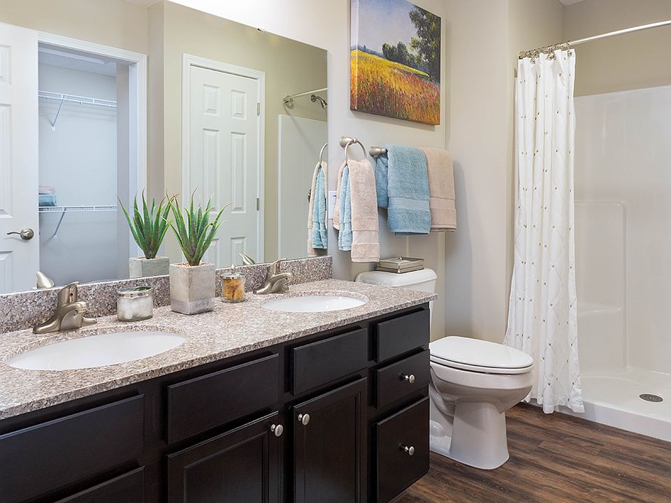 Granite Countertops & Sleek Cabinetry in Many Bathrooms