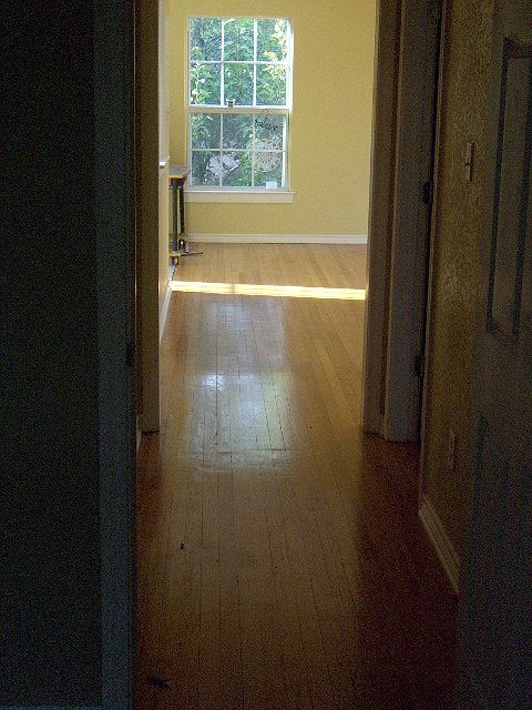 The hall between the bedrooms. The bathroom is on the right.