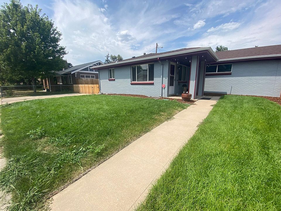 Front entrance with two parking spots on property to the left