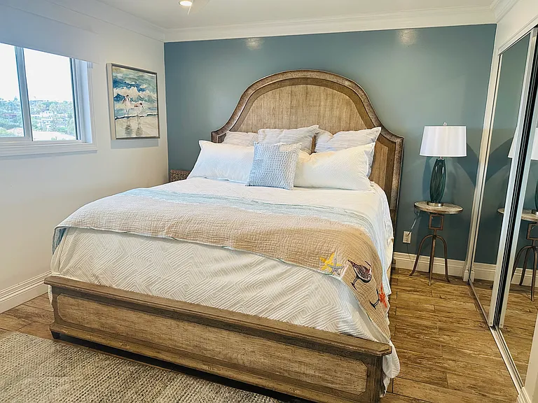 Guest bedroom with views of hills all the way to Seaworld's tower and seasonal fireworks displays.