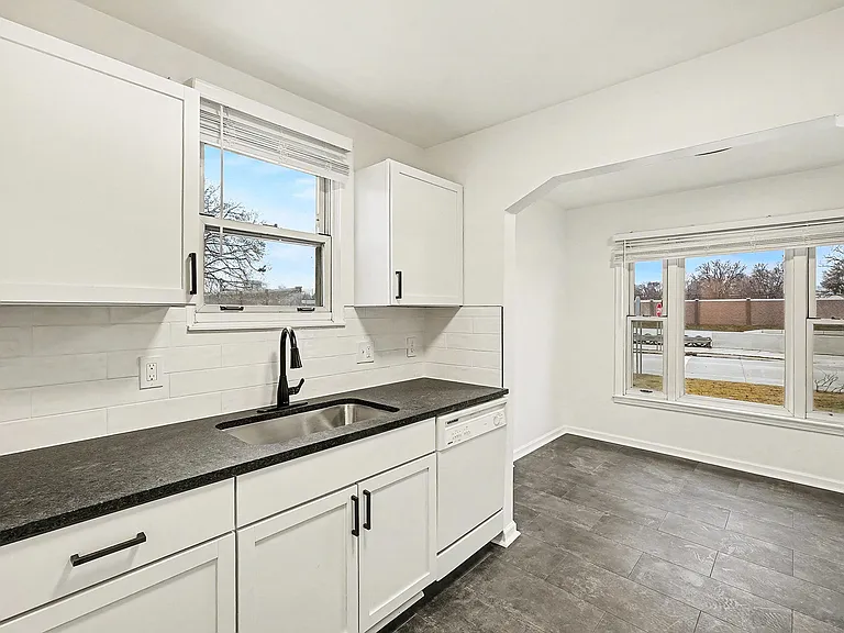 Updated kitchen with new cabinets, granite countertops, flooring, blinds and more!