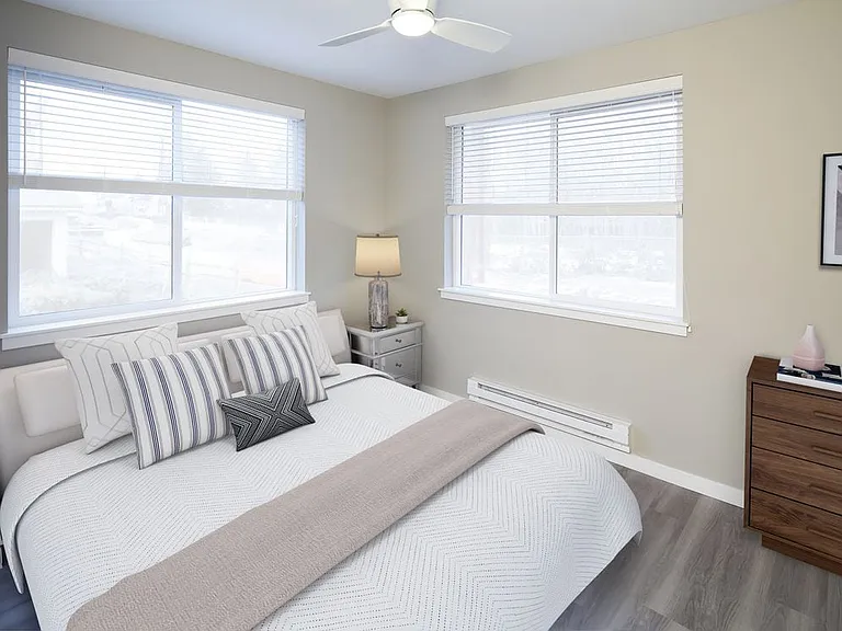 Bedroom with ceiling fan and hard surface flooring