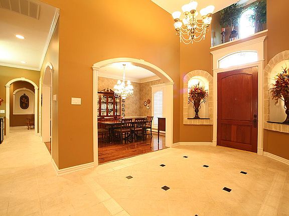 Entryway with Art Niches overlooking beautiful dining room!