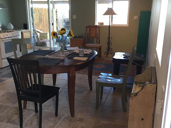 Living area. 15x20 approx. Sliding glass door faces west.