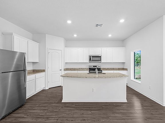 This move-in ready home features gorgeous granite countertops in the kitchen