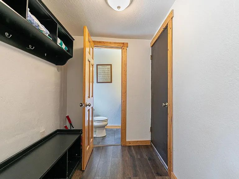 Downstairs half bath and mudroom off garage entrance