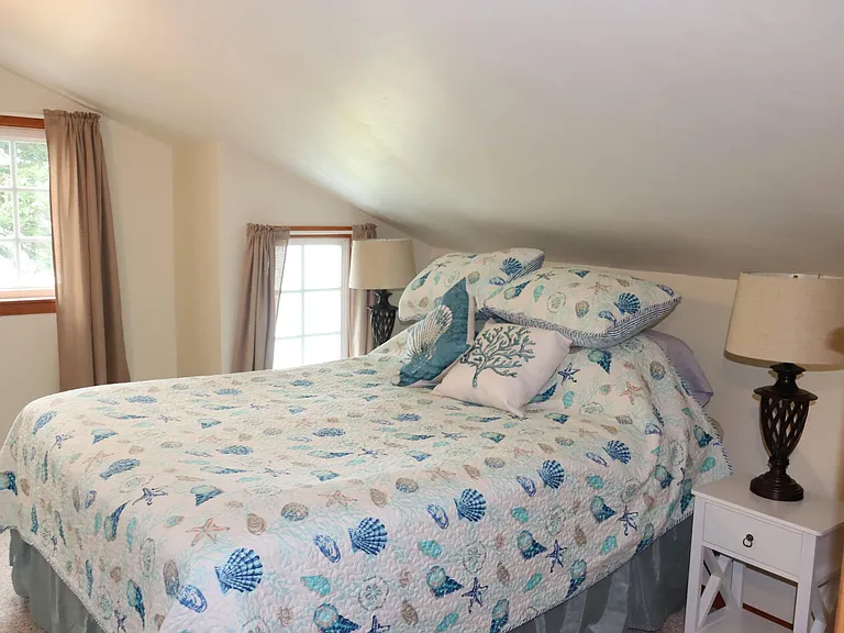 Upstairs Master bedroom with views to the Bay. Queen Bed.