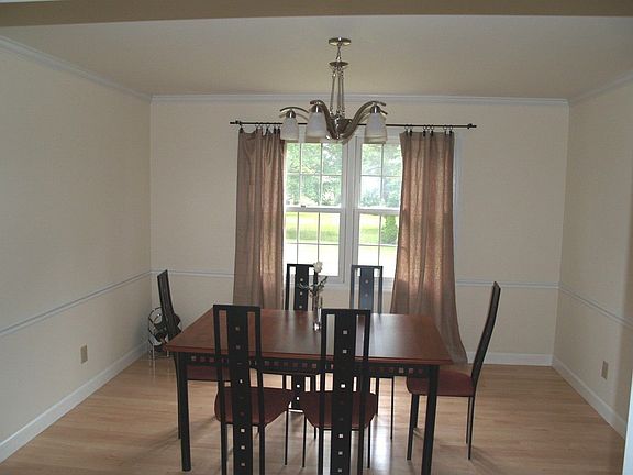 Formal dining room with chair rail and crown mold
