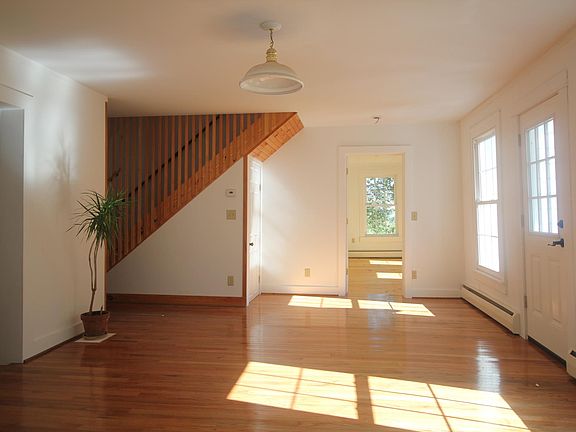 Light streaming through the front door and windows.
