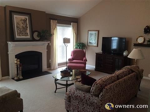 Living Room with Vaulted Ceiling & Fireplace