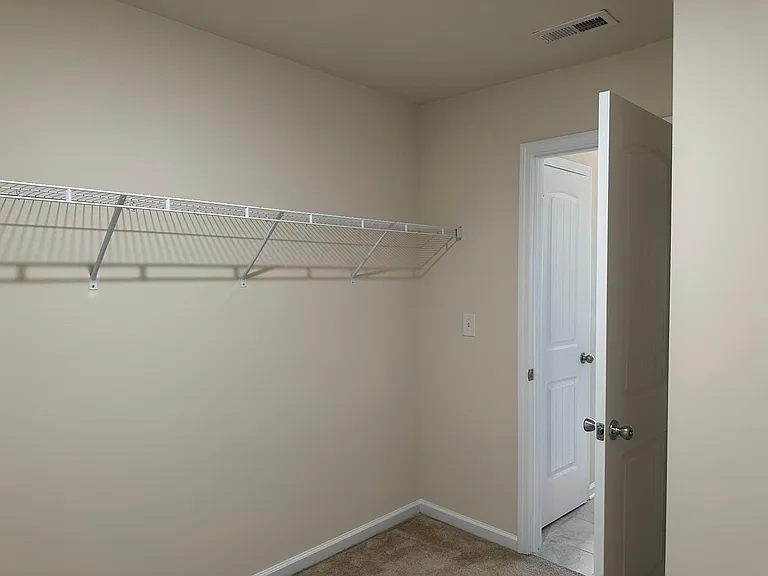 A view from the opposite corner of the main bedroom walk in closet.