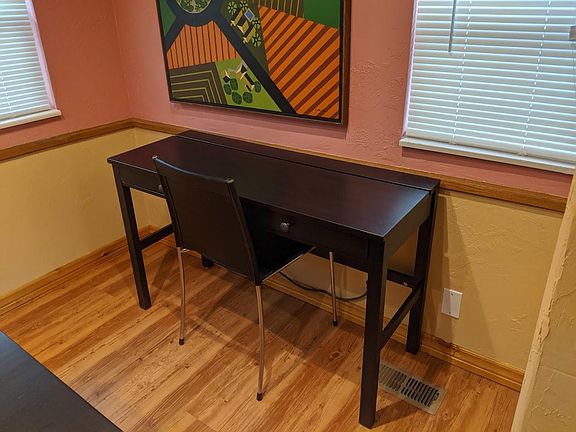 Desk with drawers and hidden power strip.