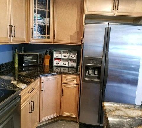 Kitchen with granite countertops and premium cabinets