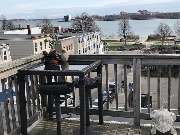 Roof Deck looking at beach 100 steps away. We swim, sun bathe, volley ball, games all summer long!