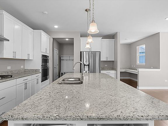 Stunning kitchen with stainless steel appliances, granite counters, and open concept