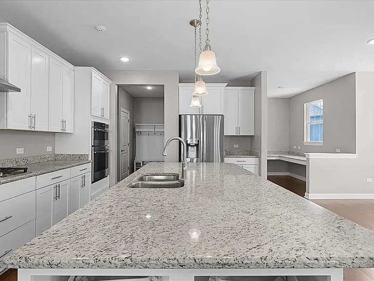 Stunning kitchen with stainless steel appliances, granite counters, and open concept