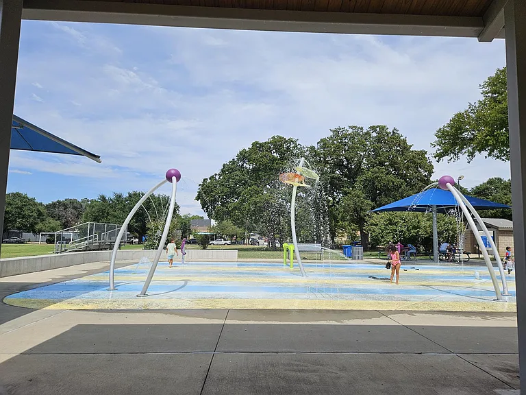 Splashpad/sprayground. If you look close, you can see the second-story roof down the street.