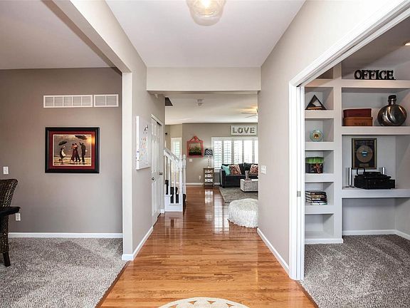 Entry foyer features wood flooring and opens to office/sitting room, dining room and great room. Home has been professionally painted in September of 2018 and newer carpeting installed in 2015.