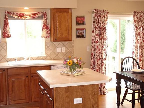 Bright kitchen with separate eating area.  Opens to family room, and deck.