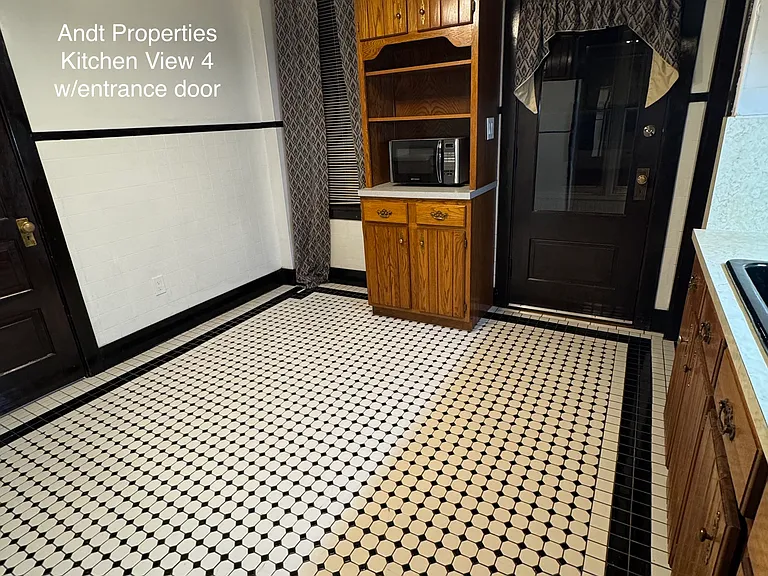 Kitchen view with entry door