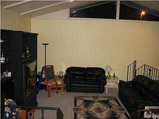 Sunken living room with vaulted ceilings
