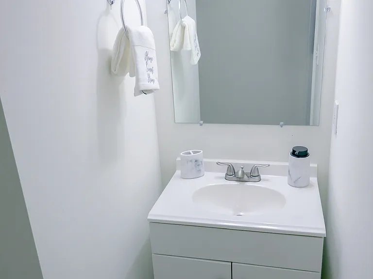 Convenient main-level half bath with updated vanity and clean, modern finishes_perfect for guests.