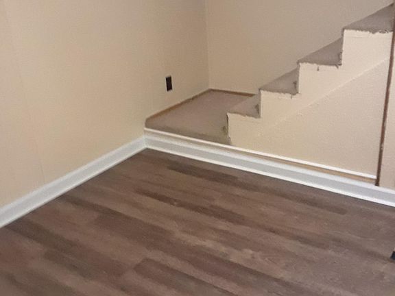 picture of living room with view of stairs leading to 2nd bedroom