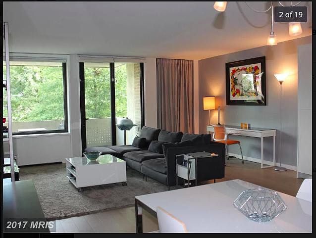 Main room; minimalist decor. Space behind curtain can be storage or an office nook.