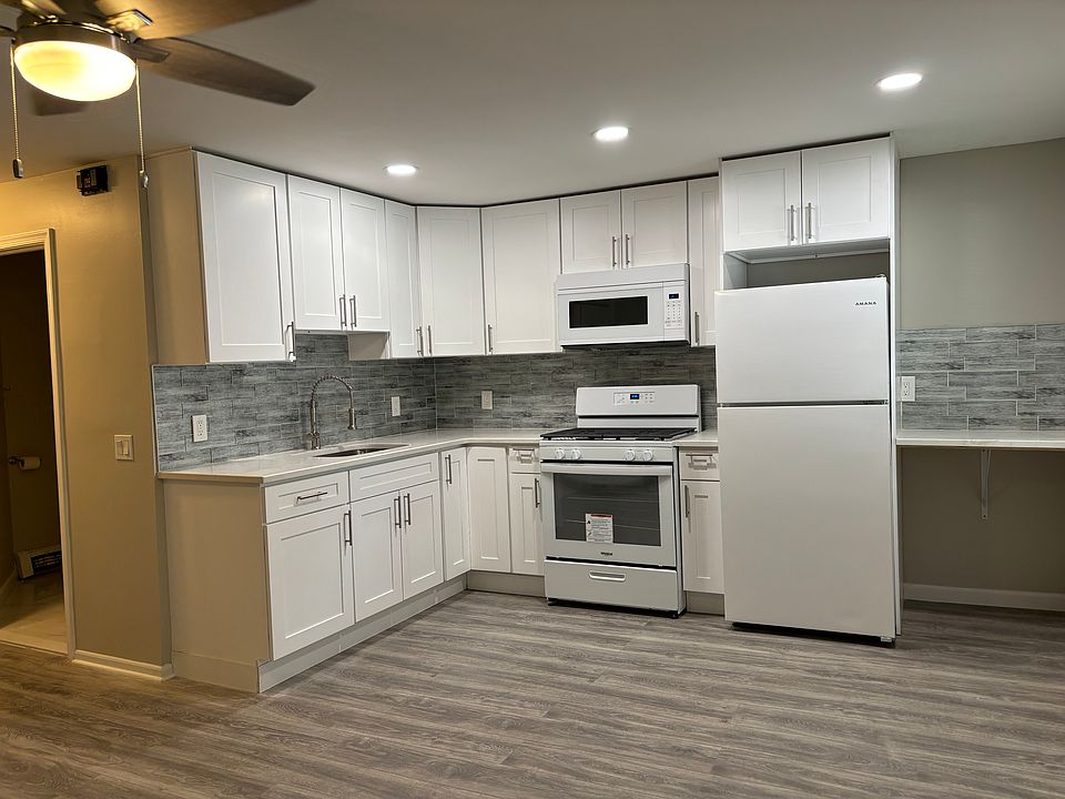 Renovated kitchen lots of cabinets, granite countertops