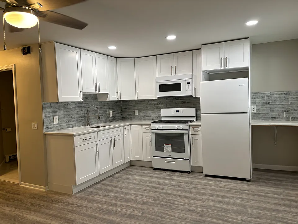 Renovated kitchen lots of cabinets, granite countertops