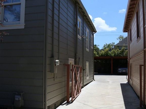 Gated parking. Shared deeded easement to access back yard.