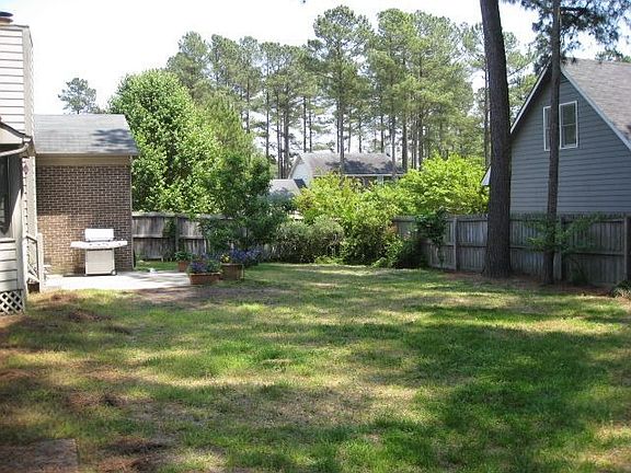Fenced back yard with patio