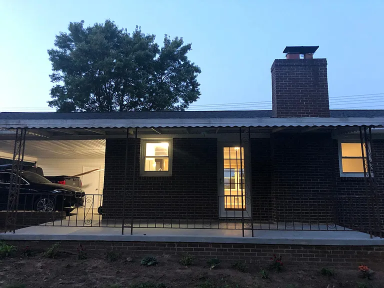 Back of house with covered porch