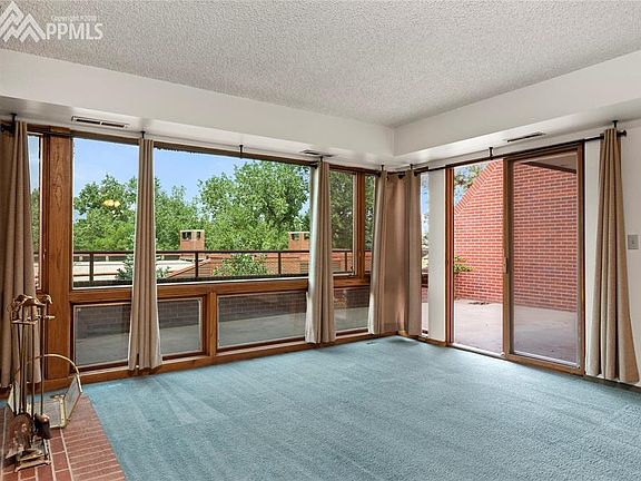 Wall of windows and a slider to your private patio.