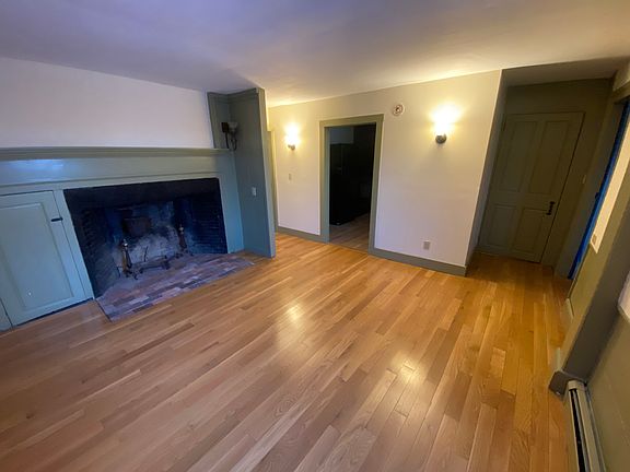 Living room off kitchen and main entry foyer room. (non-working fireplace)