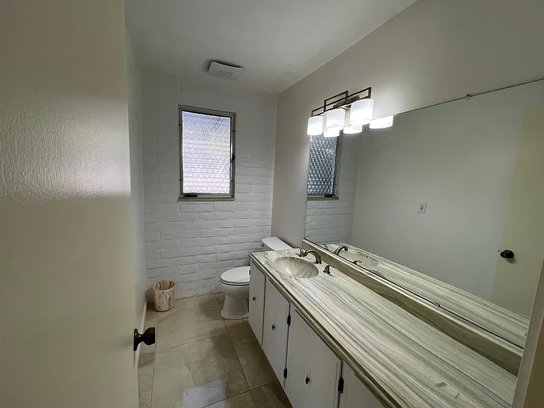 Half bathroom off front hallway.
