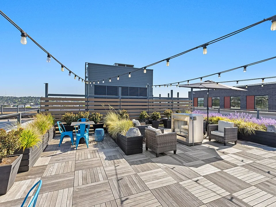 Fire up the grill and dine under string lights with sweeping rooftop views