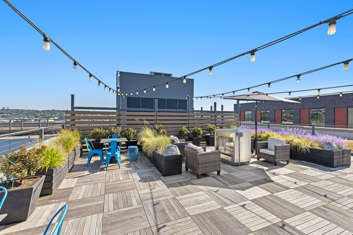 Fire up the grill and dine under string lights with sweeping rooftop views
