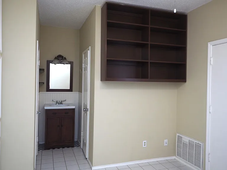 Bedroom with built in bookshelf