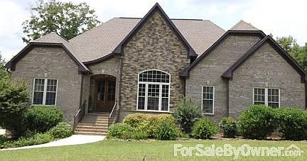 Lovely Brick and Stacked Stone
						:
						Front brick and stacked stone w rear and side full brick Poured concrete bsmt.