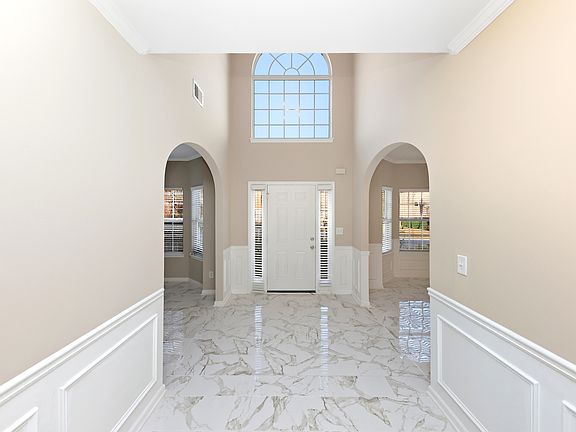 Entry way and foyer from hallway.