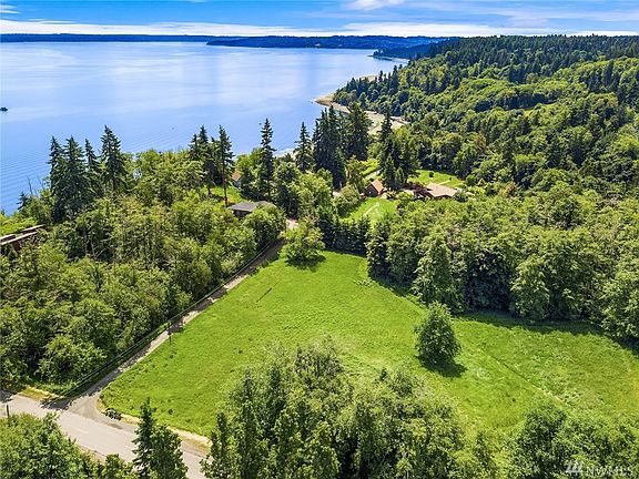 Aerial view looking south over the north field to home and gardens beyond. 