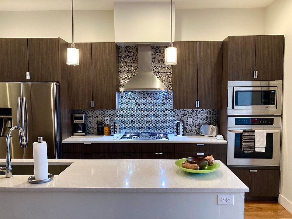 Quartz countertops + stainless appliances